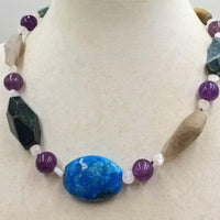 Druzzy, agate, moonstone, sterling silver toggle, hand-knotted necklace with purple silk. 19.75" length.