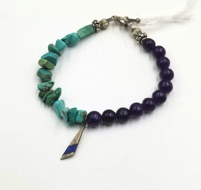 Very pretty. Turquoise, howlite, fluorite, sterling, lapis lazuli, toggle bracelet. 7