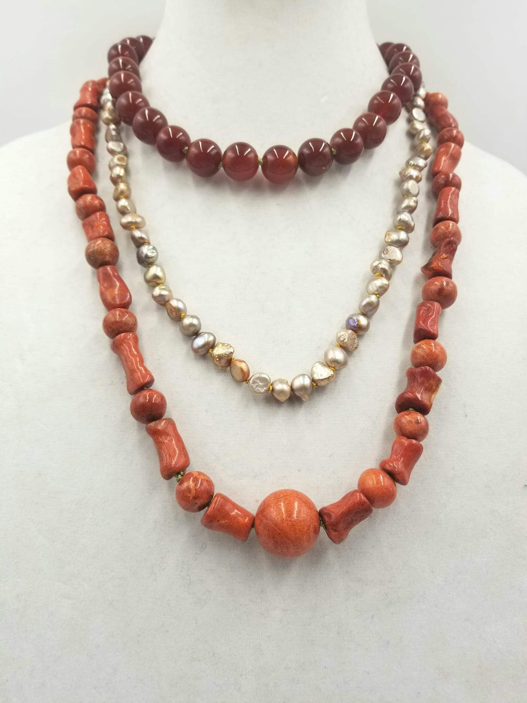 "Etna's Descendants" A 3-strand, sponge coral, pearl, carnelian necklace  with Sterling Silver accents & clasp. At Angst Art Gallery, Vancouver, WA