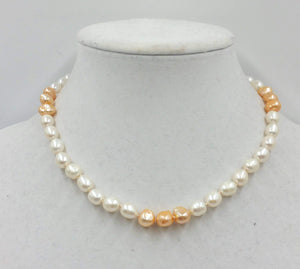 2-tone pearl choker with sterling silver clasp and accents on beige silk. 17in length.
