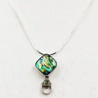 Sterling silver, abalone, and peridot pendant necklace.