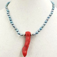 Blue dyed pearls and heavy sterling silver necklace with branch coral pendant.