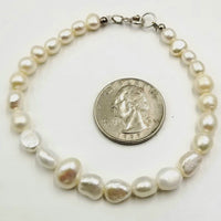 Plus size sterling silver, graduated white pearl bracelet. Classic!
