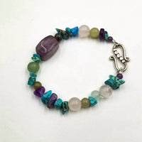 Amethyst, jadeite, dyed howlite, and rose quartz sterling silver bracelet.  6.75"