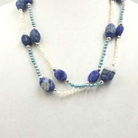 Ultra long art deco inspired freshwater cultured pearls, lapis lazuli, and sterling silver necklace.