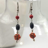 Sterling silver, onyx, coral, and red rhinestones earrings.