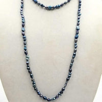 Past Work. Rope of black and blackish blue pearls.