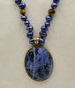PRICE REDUCED Indigo dyed freshwater cultured pearls & tiger's eye necklace with brass sodalite pendant with hand-knotted coppertone silk.