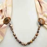 Unique. Bronze pearls, myrtle wood, cape clasp on crimson silk.