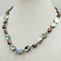 Sterling silver, abalone, bronze baroque pearls, with aquamarine focal necklace on hand-knotted sky blue silk. 21.25" length.