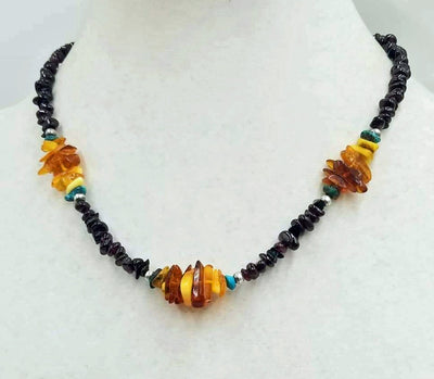 Past Work. Really special. You will get lots of compliments. Sterling silver, garnet, Baltic amber, turquoise necklace. Vegan. 18
