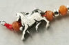 Love Horses? Sterling silver, orange aventurine, & silvertone horse charm, necklace hand-knotted with crimson silk. 19" length.