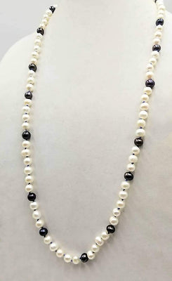 Classic & beautiful, yet modern.  Black & peacock pearl rope necklace hand-knotted with periwinkle silk. 35