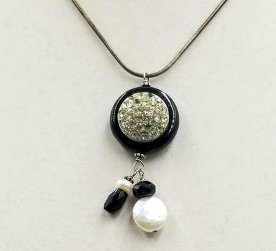 Simply beautiful. Sterling silver, onyx, & pearl pendant necklace. 16