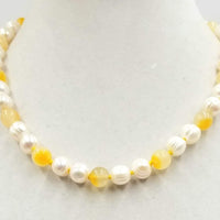 Classy & Unusual. 14K yellow gold, pearl, & Precious Yellow Jadeite necklace. Masterly hand-knotted with golden silk. 19" length.