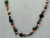 PRICE REDUCED Opera length multicolor pearl, coral, labradorite, sunstone, citrine, and chrysopraise on scarlet silk with 14KYG clasp and accents.