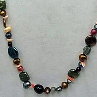 Opera length multicolor pearl, coral, labradorite, sunstone, citrine, and chrysopraise on scarlet silk with 14KYG clasp and accents.