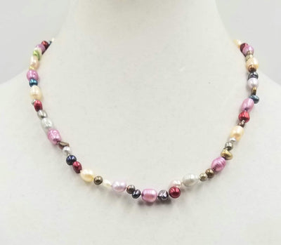 Beautiful multi-colored pearls, 14KYG, necklace on white silk. 20