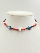 Adjustable sterling, coral, pearl, and nephrite jade choker silk.