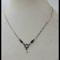 Delicate, dainty, and beautiful sterling, marcasite, and freshwater pearl Star of David pendant necklace.