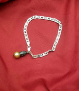 Sterling silver marine link and pink freshwater pearl charm bracelet.