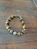 Sterling silver, tiger's eye, and black pearl Victorian floral necklace bracelet set.