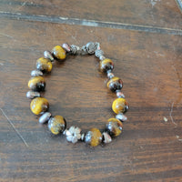 Sterling silver, tiger's eye, and black pearl Victorian floral necklace bracelet set.