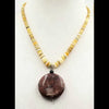 Graduated heishi shell and red jasper pendant necklace.