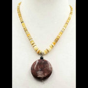 Graduated heishi shell and red jasper pendant necklace.
