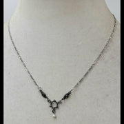 Delicate, dainty, and beautiful sterling, marcasite, and freshwater pearl Star of David pendant necklace.