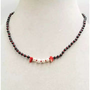 Vampire's Kiss hematite, pearl, coral, and sterling silver adjustable necklace.