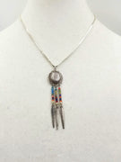 Sterling silver and glass concho pendant necklace.