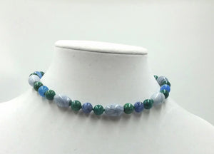 Bold Malachite, sodalite, marble, and crackle agate sterling silver choker on green silk.