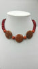 Tritone coral and sterling silver adjustable choker necklace.