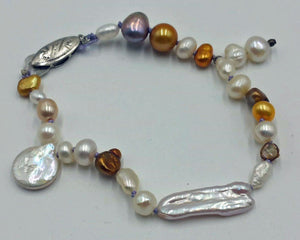 Vintage, silver, multi-colored baroque pearl, lavender silk, bracelet. Very pretty.