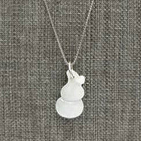 Nearly white celadon jadeite pendant shaped like a gourd. Sterling silver chain.