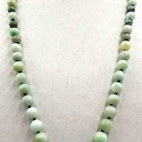 Past Work. Rope of celadon, apple, & spinach jadeite jade on, individually knotted on green silk. Sold