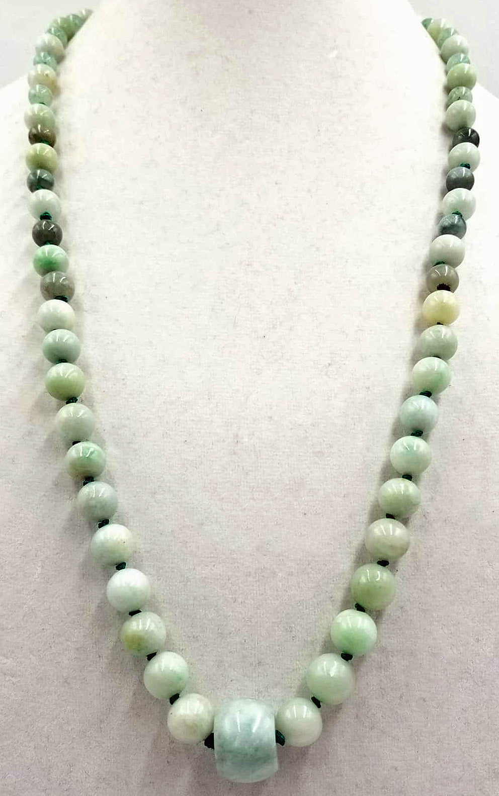Past Work. Rope of celadon, apple, & spinach jadeite jade on, individually knotted on green silk. Sold