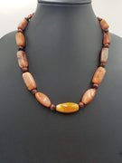 PRICE REDUCED Antique red agate, mahogany tiger's eye, & sterling silver on crimson silk. 21.5" Length