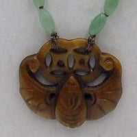 Rope length, ombre, jadeite necklace with vintage nephrite bat pendant on chocolate silk.