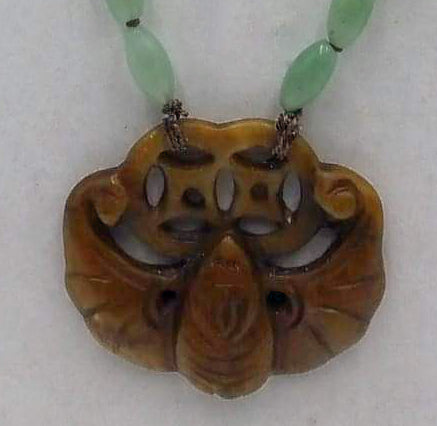 Rope length, ombre, jadeite necklace with vintage nephrite bat pendant on chocolate silk.