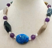 Druzzy, agate, moonstone, sterling silver toggle, hand-knotted necklace with purple silk. 19.75" length.