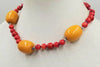 Unusual & Bold. 14KYG, coral and bold faturan choker, white silk. 17.5" length.