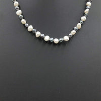 Past Work. Alternating black & white pearl necklace with sterling silver on baby blue silk. Sold.