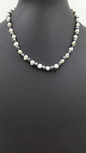 Past Work. Alternating black & white pearl necklace with sterling silver on baby blue silk. Sold.