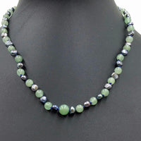 2-tone jadeite & black pearl, sterling silver, necklace on navy silk. 17.5-19" Princess length.
