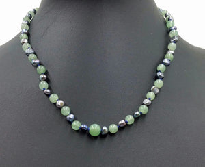 2-tone jadeite & black pearl, sterling silver, necklace on navy silk. 17.5-19" Princess length.