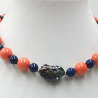 Bold. Tangerine tridacna pearl, lapis lazuli & large black Baroque pearl necklace. 17" Princess length.