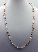 PRICE REDUCED Opera length 32", multi-color, Baroque pearl necklace, adjustable sterling silver clasp. Master hand-knotting with purple silk.