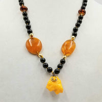 "Sweet Forgotten Fang." Whidby jet, Baltic amber, adjustable 14KYG, & antique Scottish amber pendant. 24" to 27" length.